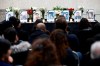 People gather on Jan. 10, 2020, at the University of Manitoba in Winnipeg for a vigil organized by the University of Manitoba Iranian Students Association (UMISA) for the Winnipeg victims killed in a plane crash in Iran. Victims from left to right are: Forough Khadem, Bahareh Hajesfandiari (41) Anisa Sadeghi (10) and Mohammad Sadeghi, Amir Hossein Ghorbani (21), Farzaneh Naderi (38) and Noojan Sadr (11), Amirhossien Ghasemi (32), Farhad Niknam (44), and Mojgan Daneshmand, Pedram Mousavi, Daria Mousavi (14) and Dorina Mousavi (9). THE CANADIAN PRESS/John Woods