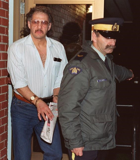 Allan Legere leaves court as he waits for jurors in his murder trial to return a verdict in Burton, N.B. on Nov. 2, 1991. As the Parole Board prepares to consider the supervised release of serial killer Allan Legere, some who lived through his terrifying rampage 31 years ago warn he can never be rehabilitated. The Canadian Press/Andrew Vaughan