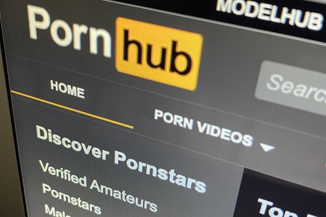 The Pornhub website is shown on a computer screen in Toronto on Dec. 16, 2020. A young woman whose life was shattered by a video of her posted to Pornhub while she was still in middle school says the trauma of child pornography is unending, and that stricter rules are need. THE CANADIAN PRESS