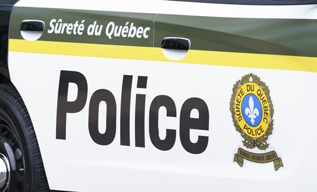 A Sûreté du Québec police car is seen in Montreal on July 22, 2020. Quebec provincial police say the discovery of two bodies in a home northeast of Montreal involved a murder followed by a suicide. THE CANADIAN PRESS/Paul Chiasson