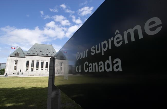 Clouds pass by the Supreme Court of Canada in Ottawa, Friday June 12, 2020. THE CANADIAN PRESS/Adrian Wyld