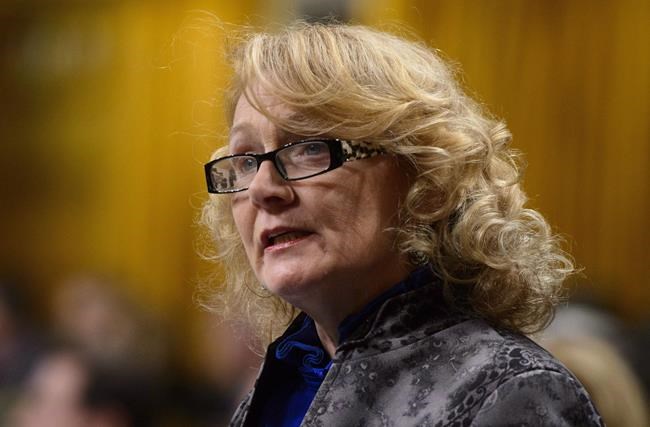 Liberal MP Karen McCrimmon stands during question period in the House of Commons on Parliament Hill in Ottawa on Monday, Oct. 22, 2018. McCrimmon isn't seeking re-election in a west-Ottawa riding. THE CANADIAN PRESS/Sean Kilpatrick