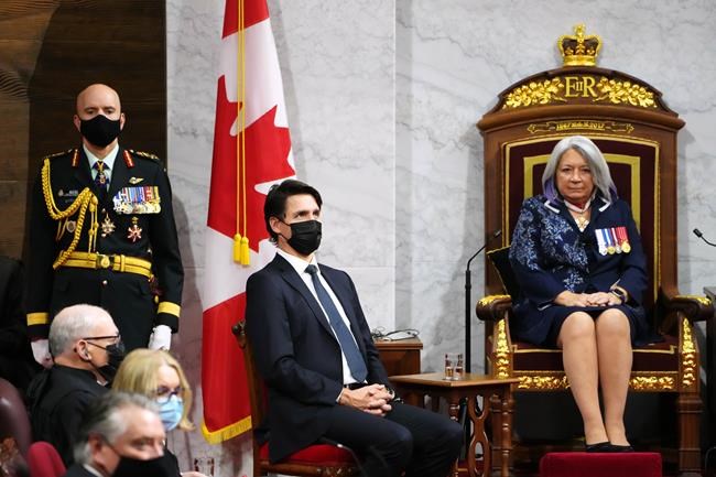 Prime Minister Justin Trudeau looks up after Gov. Gen. Mary Simon delivered the Throne Speech in the Senate in Ottawa on Tuesday, Nov. 23, 2021. THE CANADIAN PRESS/Sean Kilpatrick