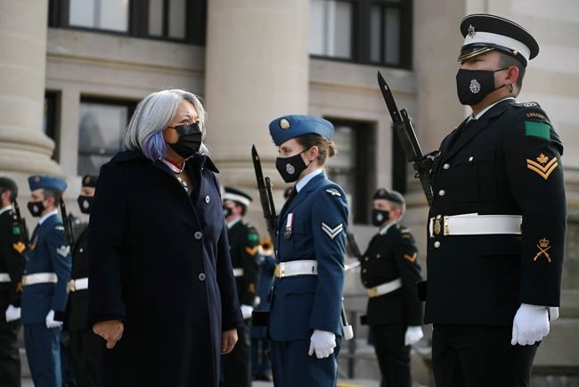 Gov. Gen. Mary Simon inspects the honour guard as she arrives ahead of the Throne Speech in the Senate in Ottawa on Tuesday, Nov. 23, 2021. THE CANADIAN PRESS/Justin Tang