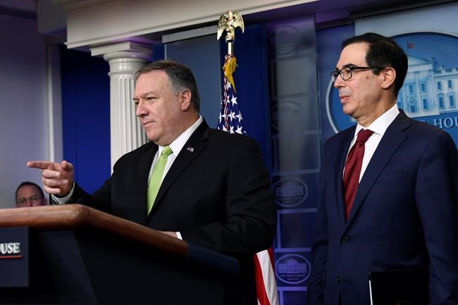 Treasury Secretary Steven Mnuchin, right, and Secretary of State Mike Pompeo, left, speak during a briefing at the White House in Washington, Friday, Jan. 10, 2020. (AP Photo/Susan Walsh)