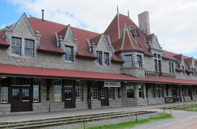 The exterior of the historic railway station in McAdam, N.B., once part of Canadian Pacific Railway's main line into Atlantic Canada, is shown on June 16, 2012. A year after a tiny village in New Brunswick attracted national attention by announcing it would sell 16 housing lots for $1 apiece, the mayor says the novel bid to attract newcomers has been an unqualified success. THE CANADIAN PRESS/Melanie Patten