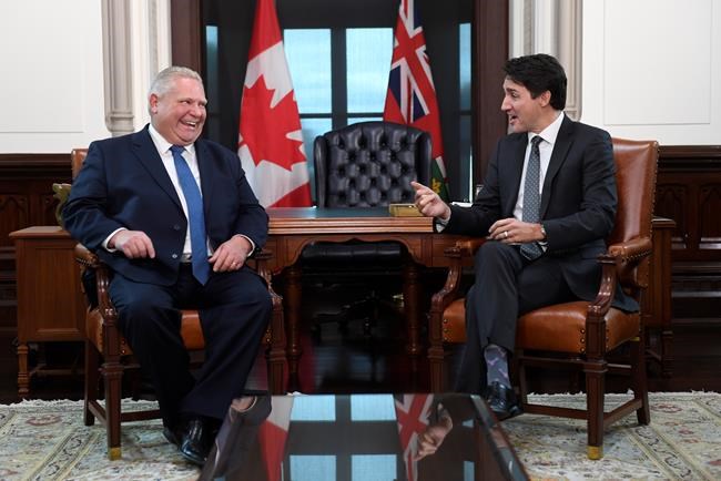 Prime Minister Justin Trudeau and the Premier of Ontario Doug Ford share a laugh after Ford spoke in French during a meeting in Ottawa on Friday, Nov. 22, 2019. THE CANADIAN PRESS/Adrian Wyld