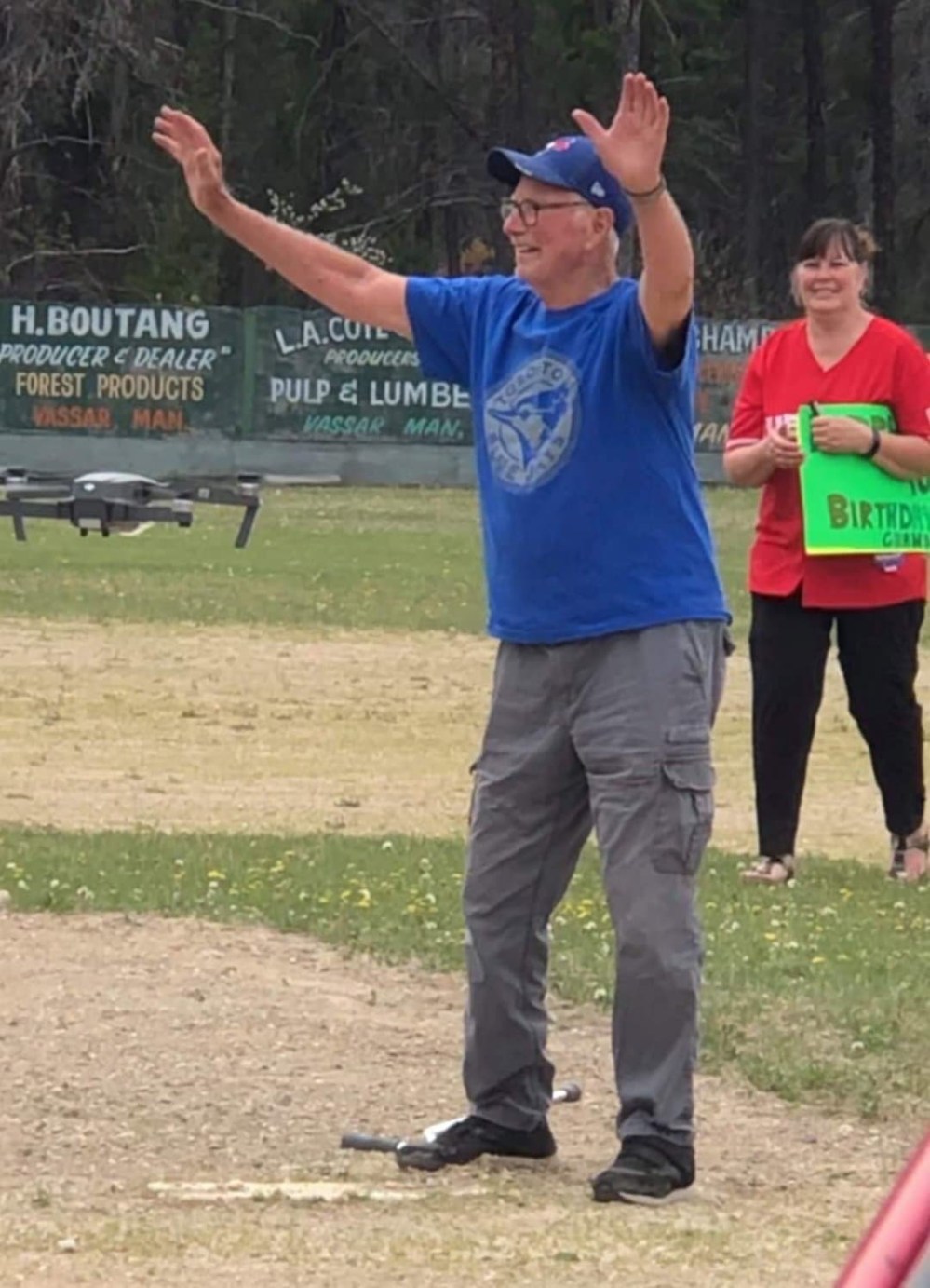 Supplied Photo
Cub Cayer raises his arms in celebration after throwing pitches on his 90th birthday.