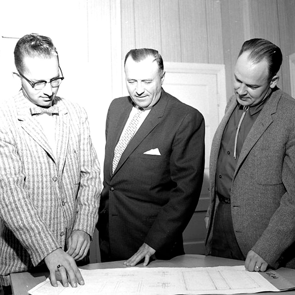 Carillon Archives
Three members of the Steinbach Playground Association, Bob Loewen, John D. Penner and Alvin Reimer, look over plans for a new skating rink to be built in the fall of 1959, as the first phase of a $35,000 project that will see a gymnasium complex with three ice surfaces constructed as soon as funds can be raised.