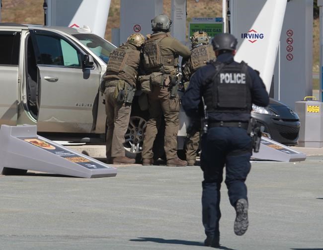 As the RCMP investigate the case of the Nova Scotia gunman who killed 22 people during a 13-hour rampage last month, a key question remains unanswered: Why? RCMP officers prepare to take a person into custody at a gas station in Enfield, N.S., Sunday, April 19, 2020. THE CANADIAN PRESS/Tim Krochak