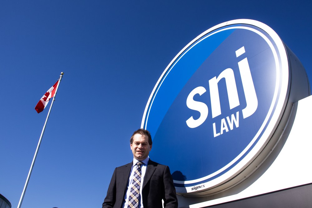 TIMOR SYROTA / THE CARILLON
Grant Driedger stands in front of his law firm’s office in Steinbach.
