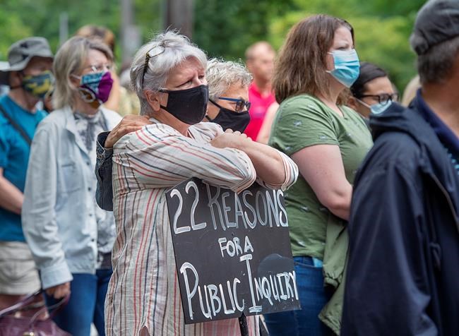 Protesters gather in Halifax's Victoria Park to demand a public inquiry into the deadly mass shootings that claimed 22 lives in Nova Scotia last April, on Monday, July 27, 2020. The federal and provincial governments have announced a review of the massacre that will not be able to compel witnesses or testimony, no power to subpoena evidence and won't be able to make binding recommendations to the government. THE CANADIAN PRESS/Andrew Vaughan