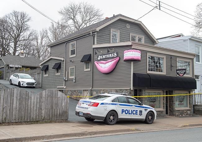 The Atlantic Denture Clinic is guarded by police in Dartmouth, N.S. on Monday, April 20, 2020. The business is owned by alleged killer Gabriel Wortman. Police say 17 people are dead, including RCMP Const. Heidi Stevenson, after a man went on a murder spree in several Nova Scotia communities. Wortman, 51, was shot and killed by police. THE CANADIAN PRESS/Andrew Vaughan