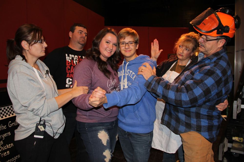 IAN FROESE | THE CARILLON
Will their love withstand their families' disapproval? Amberly Wiebe and Todd Rekrut, playing Anna and Nick, are the couple in love. Their parents are less than accepting of their courtship. Playing Anna's parents are, from left, Anna Wall and Nathan Sawatzky, and, from right, Todd's parents are Sharon and Rob Steeves.