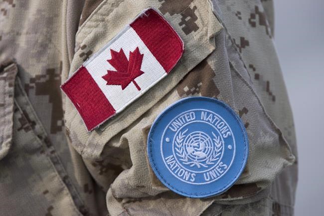 Canadian flag and the UN flag is shown on the sleeve of a Canadian soldier's uniform before boarding a plane at CFB Trenton in Trenton, Ont., on July 5, 2018. Canada's contribution to peacekeeping has reached what is believed to be an all-time low, even as the Liberal government makes its final push to secure a coveted seat on the United Nations Security Council. UN figures show there were 35 Canadian military and police officers deployed on peacekeeping operations at the end of April. That represented the smallest number since at least 1956, according to Walter Dorn, a peacekeeping expert at the Canadian Forces College in Toronto. THE CANADIAN PRESS/Lars Hagberg