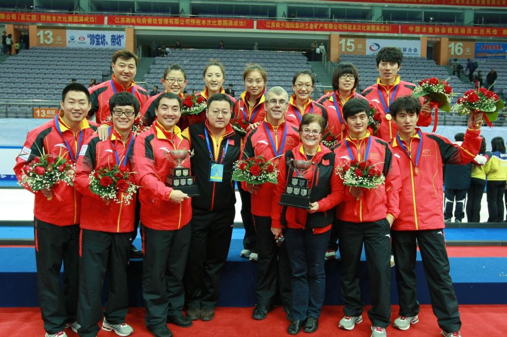 Submitted photo
Lorne and Chris Hamblin, Chinese national team coaches, pose with the team following their gold medal wins at the Pacific-Asia championships.