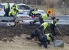 RCMP investigators search for evidence at the location where Const. Heidi Stevenson was killed along the highway in Shubenacadie, N.S. on Thursday, April 23, 2020. Ottawa and Nova Scotia are set to announce later today a joint review of the mass shooting that left 22 victims dead in April.THE CANADIAN PRESS/Andrew Vaughan