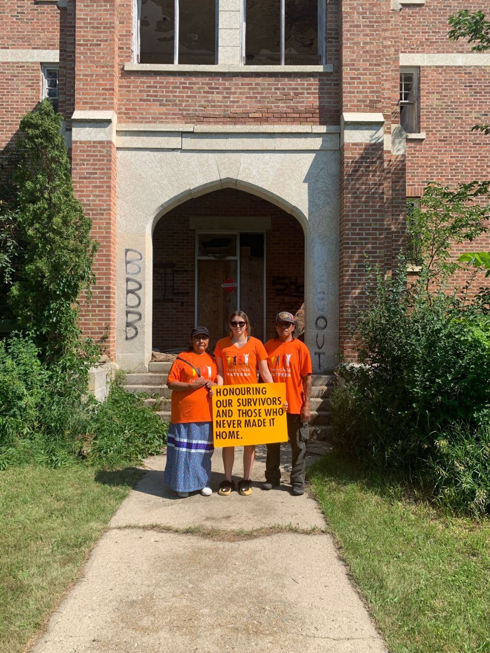 SUPPLIED PHOTO
Trechelle Bunn poses with her Kunshi (grandma) Pauline Bell, and her Unkan (grandpa) Terry Bell at Birtle Residential School on Canada Day.