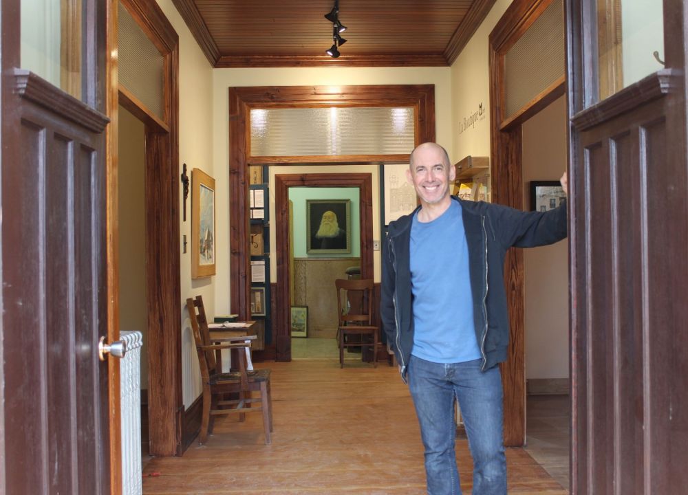 JORDAN ROSS / THE CARILLON
Sol Desharnais, who curated the new exhibit and restored the wing of the museum that houses it, prepares to welcome visitors for a sneak peek. The exhibit will open permanently this summer.