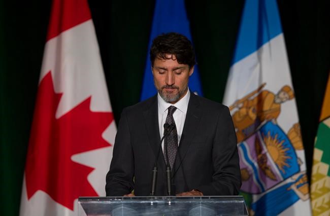 Prime Minister Justin Trudeau pauses while speaking during a memorial for the victims of the Ukrainian plane disaster in Iran this past week in Edmonton, Sunday, Jan. 12, 2020. THE CANADIAN PRESS/Todd Korol