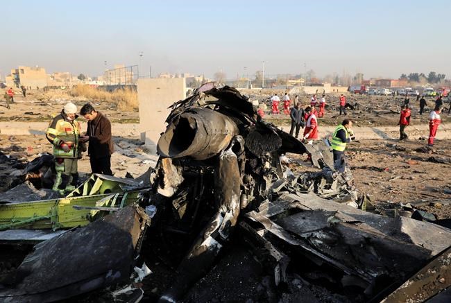FILE - In this Wednesday, Jan. 8, 2020 file photo, debris at the scene where a Ukrainian plane crashed in Shahedshahr southwest of the capital Tehran, Iran. Iran announced Saturday, Jan. 11, that its military “unintentionally” shot down the Ukrainian jetliner that crashed earlier this week, killing all 176 aboard, after the government had repeatedly denied Western accusations that it was responsible. (AP Photo/Ebrahim Noroozi, File)