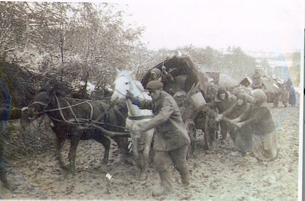 Centre for Mennonite Brethren Studies
Mennonite refugees struggle through deep mud as they flee the Soviet Union as part of the “Great Trek” in 1943.