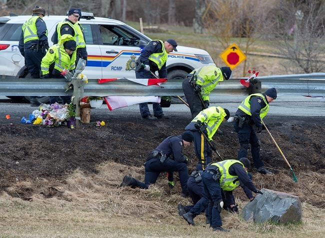 RCMP investigators search for evidence at the location where Const. Heidi Stevenson was killed along the highway in Shubenacadie, N.S. on Thursday, April 23, 2020. Police say the man who went on a murderous rampage through five Nova Scotia communities was likely using unlicensed firearms, and investigators are trying find out how he obtained illegal weapons. THE CANADIAN PRESS/Andrew Vaughan