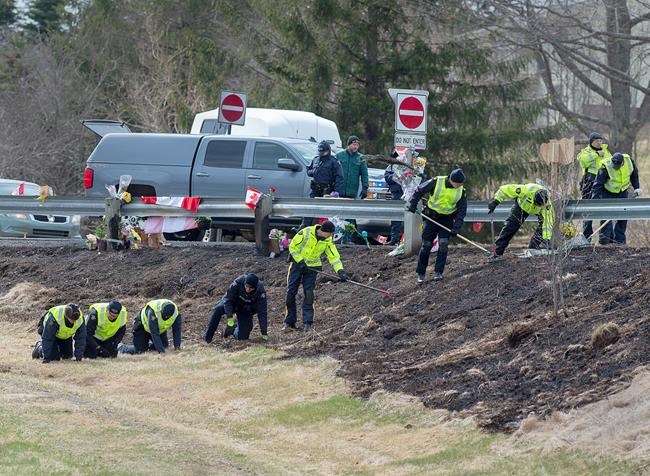 RCMP investigators search for evidence at the location where Const. Heidi Stevenson was killed along the highway in Shubenacadie, N.S. on Thursday, April 23, 2020. Police say the man who went on a murderous rampage through five Nova Scotia communities was likely using unlicensed firearms, and investigators are trying find out how he obtained illegal weapons. THE CANADIAN PRESS/Andrew Vaughan