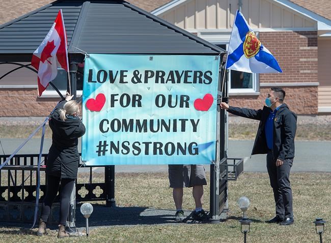 Workers at an extended care facility show their community support in Debert, N.S. on Tuesday, April 21, 2020. RCMP say at least 19 people are dead after a man who at one point wore a police uniform and drove a mock-up cruiser, went a murder rampage in Portapique, and other Nova Scotia communities. The alleged killer was shot and killed by police. THE CANADIAN PRESS/Andrew Vaughan
