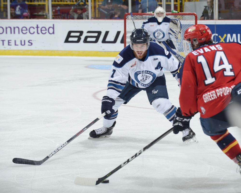 Matthew Murnaghan/Hockey Canada
Wellington Dukes forward Ben Evans bears down on Pistons' defenceman Mark Taraschuk Monday night at Chilliwack as Wellington defeated the Pistons 3-2 in overtime.
