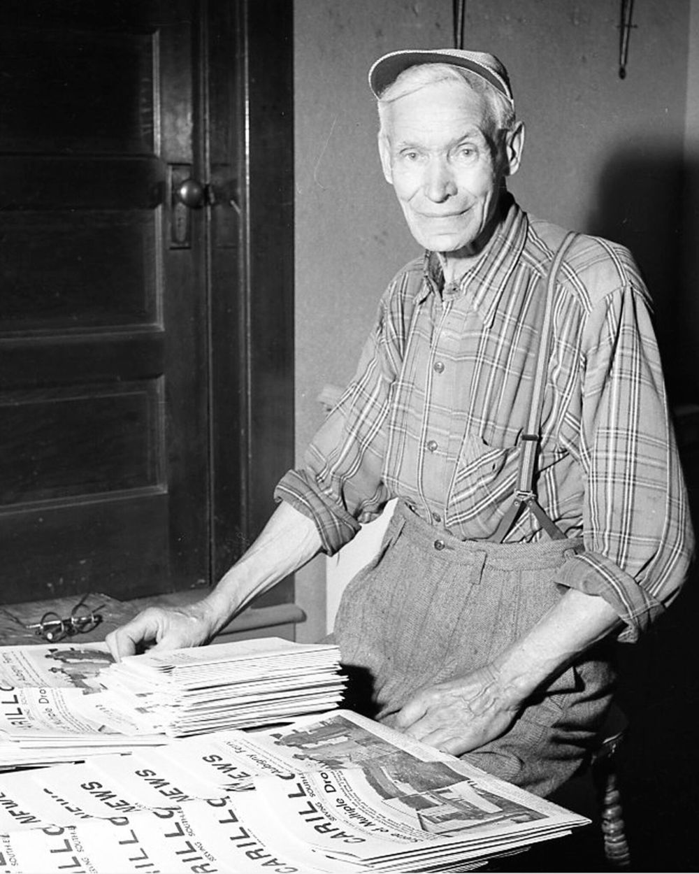 Carillon Archives
Giroux postmaster Fred Acres was the first “paper boy” for The Carillon News, putting dozens of copies of the weekly newspaper in roadside mailboxes, in an early version of door-to-door delivery.