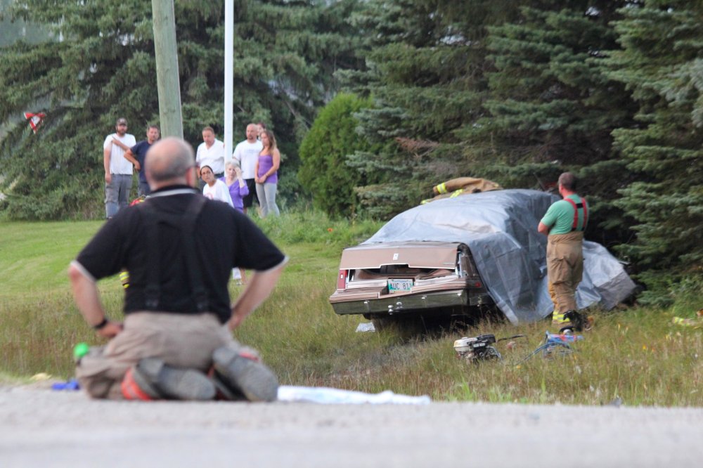 IAN FROESE | THE CARILLON
A tarp is draped over the car a 45-year-old woman was a passenger in Friday evening. She passed away after her vehicle was struck by a SUV in Anola.