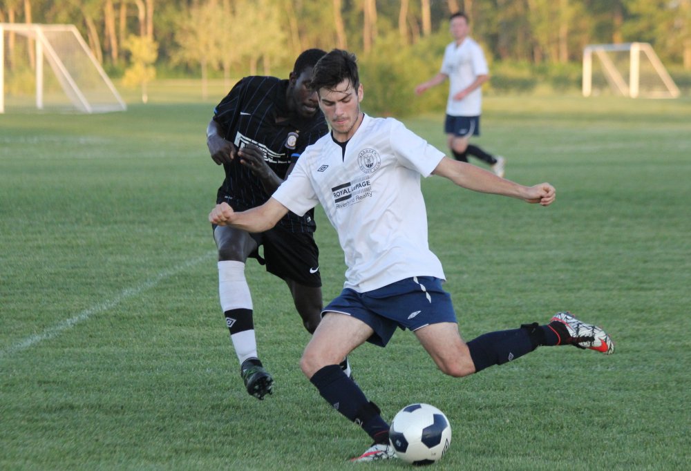 IAN FROESE | THE CARILLON
The Hanover Kickers, in white, rallied back to win 3-2 Monday night.
