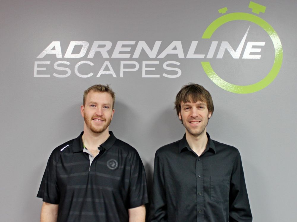 ADRIANA MINGO | THE CARILLON
Coltyn Voth and Greg Dyck pose at against the Adrenaline Escapes photo wall.