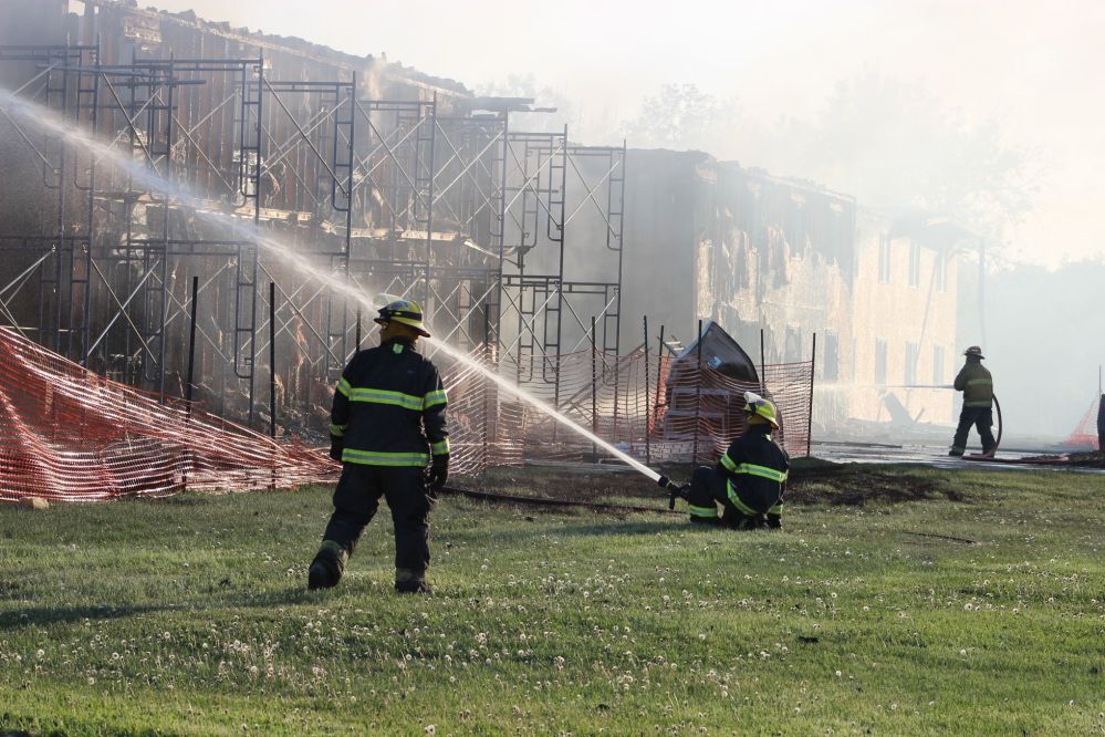 GRANT BURR | THE CARILLON
Firefighters continue hose down hot spots around 7:30 p.m. on Thursday night, after a fire destroyed Bergen Hall at Providence University College.