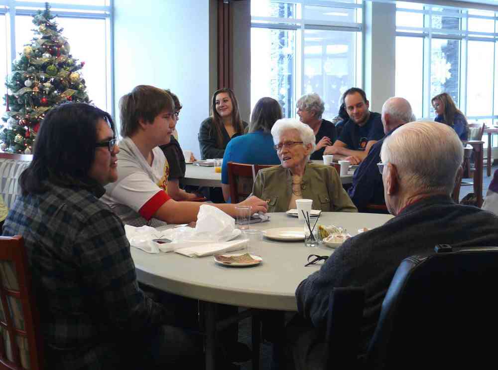 JUDY PETERS | THE CARILLON
Students and seniors enjoy tea and snacks to wrap up a successful four week project for Family Studies students at Ste Anne Collegiate. It did not take long for enough residents at Bridgepark Manor in Steinbach to sign up for the latest project that saw students writing their seniors' biographies. When the hard work was over, students and seniors celebrated with a morning visit that did not involve any work.