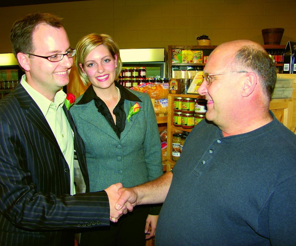 PETER DYCK | CARILLON ARCHIVES
Chris Goertzen with his wife Annalee Schellenberg, are congratulated by fellow mayoral candidate Dwight Reimer, following Goertzen's October 2006 victory. Goertzen, who was acclaimed as mayor in the subsequent two municipal elections, said Monday he will not seek a fourth term in October.