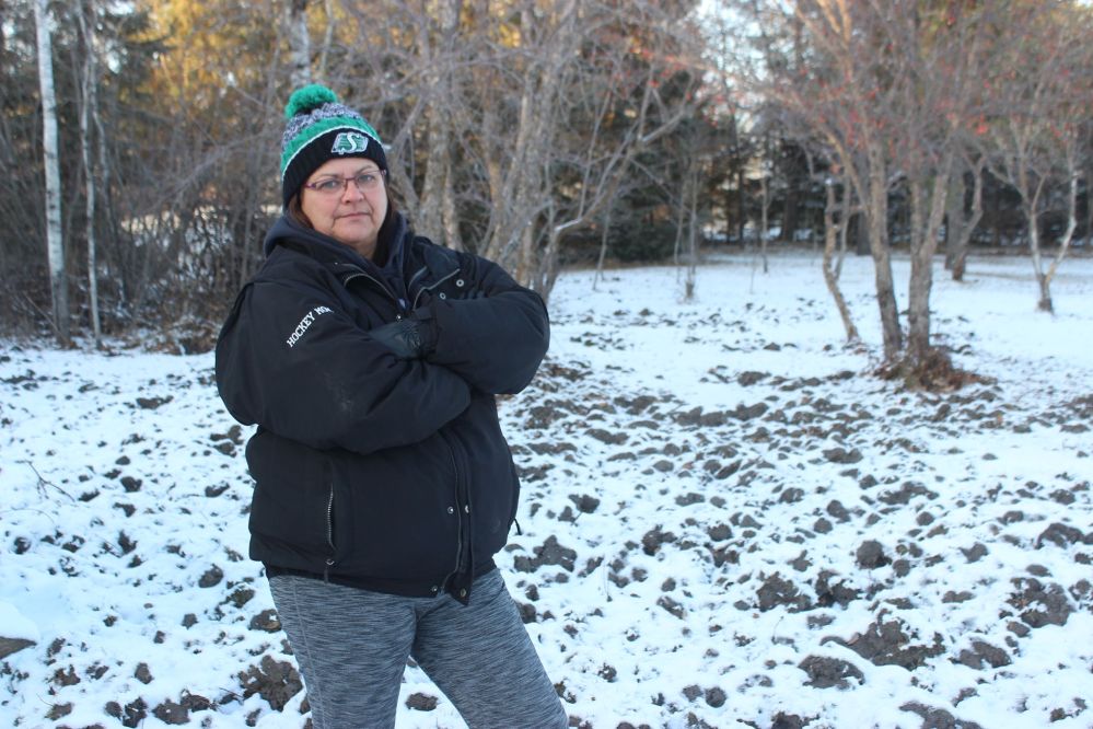JORDAN ROSS | THE CARILLON
Marchand-area resident Louise Tetrault stands amid one of several patches of lawn on her three-acre property turned to mud by animals escaping her neighbour’s farm. Tetrault said she’s frustrated by how long it’s taken to address the situation.