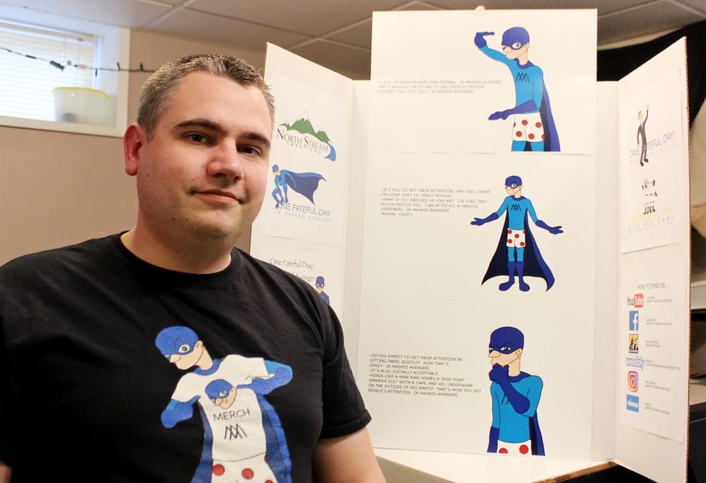 ADRIANA MINGO | THE CARILLON
Curtis Nordstrom shows off a board that details his Masked Avenger character.