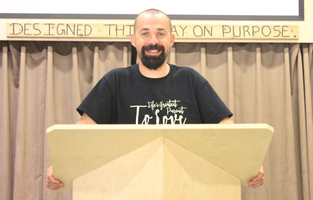 ADRIANA MINGO | THE CARILLON
Senior pastor Rick Neufeld stands behind the pulpit at Grunthal Abundant Life Fellowship.