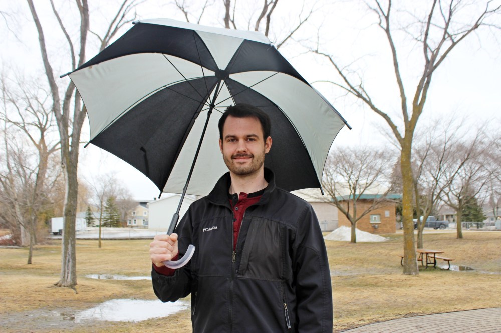 ADRIANA MINGO | THE CARILLON
Scott Kehler, Weatherlogics chief scientist, stands in K.R. Barkman Park on a rainy day