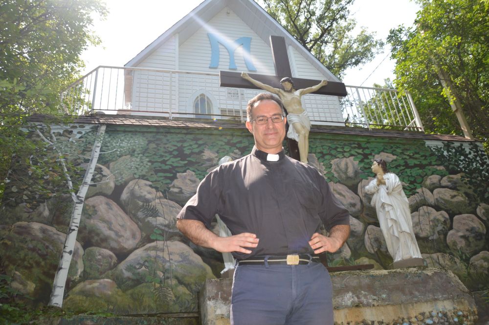 DAVE BAXTER | THE CARILLON
Father Dominic La Fleur of St Malo Parish stands at the site of the Grotto of Our Lady of Lourdes, which the Archdiocese of Saint Boniface has officially established as a diocesan shrine.
