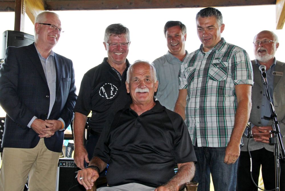 IAN FROESE | CARILLON ARCHIVES
Former Provencher MP Vic Toews is surrounded by conservative colleagues at a retirement barbeque in the summer of 2013. Toews' consulting work in the months that followed has come under scrutiny from Federal Conflict of Interest and Ethics Commissioner Mary Dawson, whose report published on Friday found the former MP in violation of the Conflict of Interest Act.