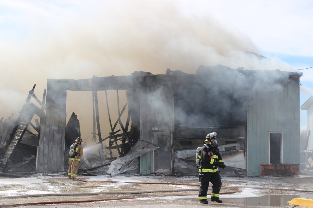 Adriana Mingo | The Carillon
Firefighters put out a fire at a truck storage building Thursday afternoon in Niverville. The building was completely engulfed in flames after a semi truck caught fire inside.