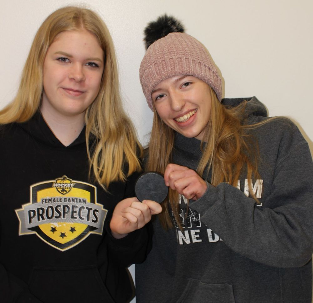 Submitted photo
Goal scorer Sydney Ouellet (left) with Kendra Wiens, who assisted on the first ever goal scored by the SRSS women`s hockey team.