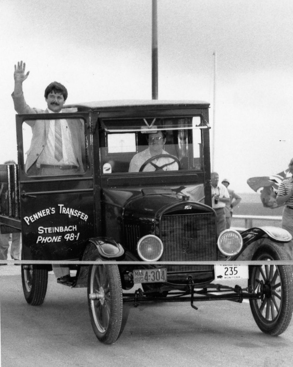 CARILLON ARCHIVES
Milton Penner drove his restored “Model T” through the ribbon while a waving Highways Minister John Plohman stood on the running board to officially mark the completion of the four-lane highway from Steinbach to the Trans-Canada Highway in 1984. The Highway 12 four-lane project included a second bridge over the Seine River Diversion and an overpass over the railway tracks west of Ste Anne.
