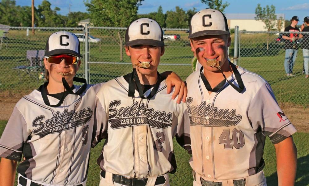 Anders Meilleur, Cedric Lagasse, Mason Hooper appear to enjoy the taste of gold after winning the 18U AAA provincial championship July 24.