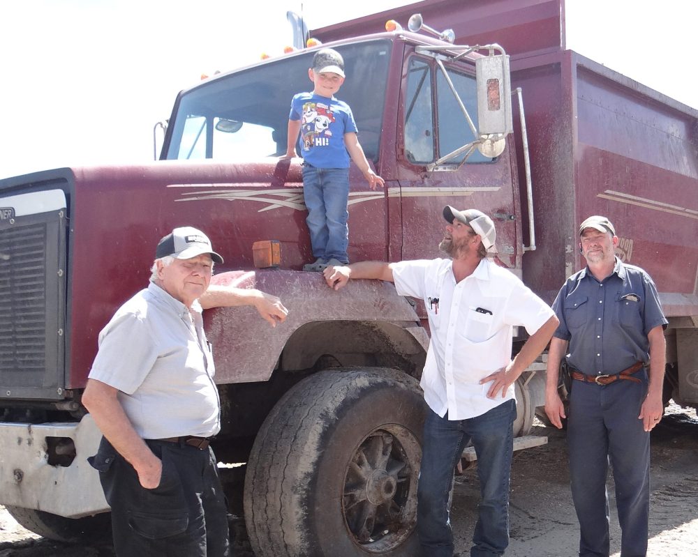WES KEATING THE CARILLON
Dean Penner joins his dad, Ellory, Uncle Lyenol and Grandpa Gilmer for a photo with the vintage 1989 truck, which is still in perfect running condition, at Pennwood Dairy.