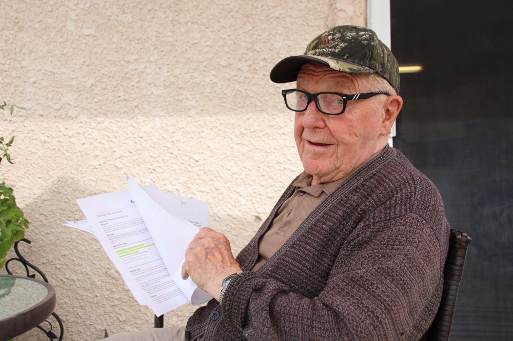 JURA MCILRAITH | THE CARILLON
Aurel Hebert, 88, looks over the paperwork Manitoba Public Insurance sent him since they issued a medical suspension of his driver’s licence last year. After completing multiple tests and exams, he has still not regained his licence.
