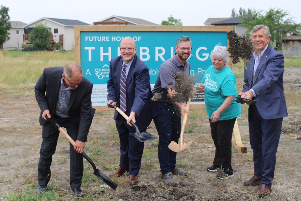 GREG VANDERMEULEN THE CARILLON
Steinbach Mayor Earl Funk, Steinbach MLA Kelvin Goertzen, SCO board chair Elroy Peters, SCO Executive Director Irene Kroeker and Provencher MP Ted Falk make the dirt fly as they take part in the sod turning for The Bridge, an affordable housing project.